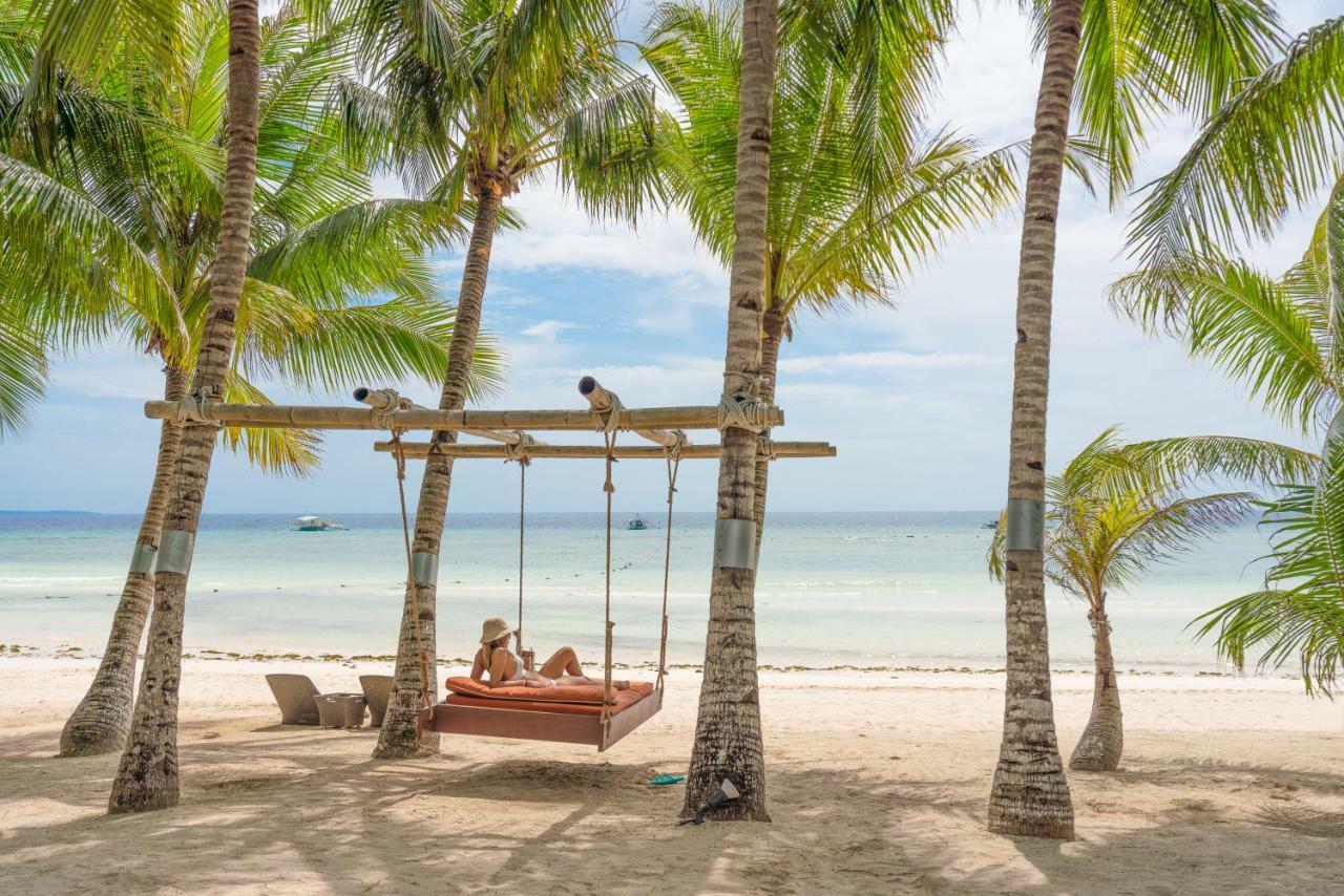Oceanica Resort Panglao, Bohol Kültér fotó A swing at the beach