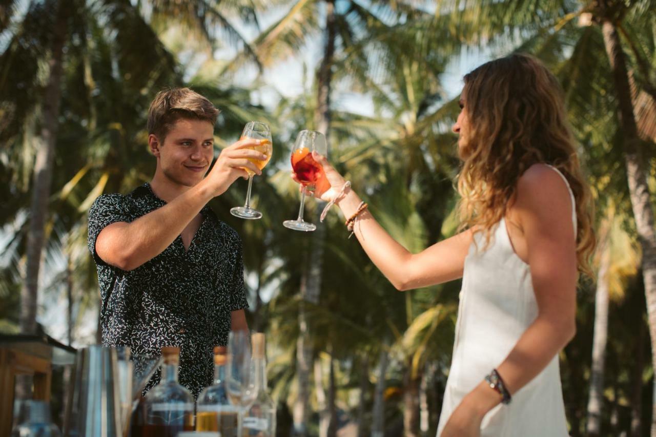 Oceanica Resort Panglao, Bohol Kültér fotó Two people toasting with wine